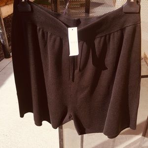 Woman’s black shorts, like wool weight and feel